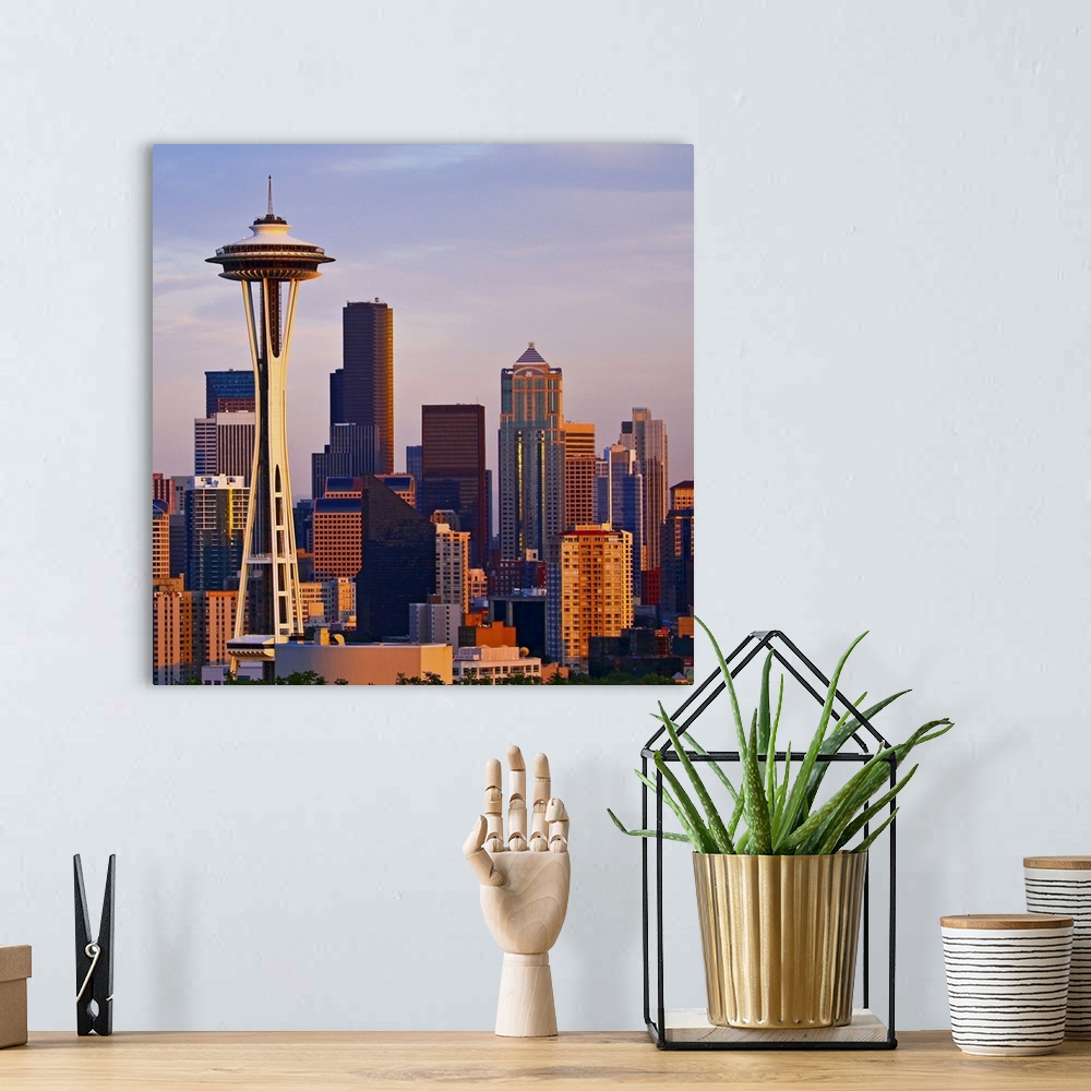 A bohemian room featuring The Space Needle is a tower at dusk in Seattle, Washington.