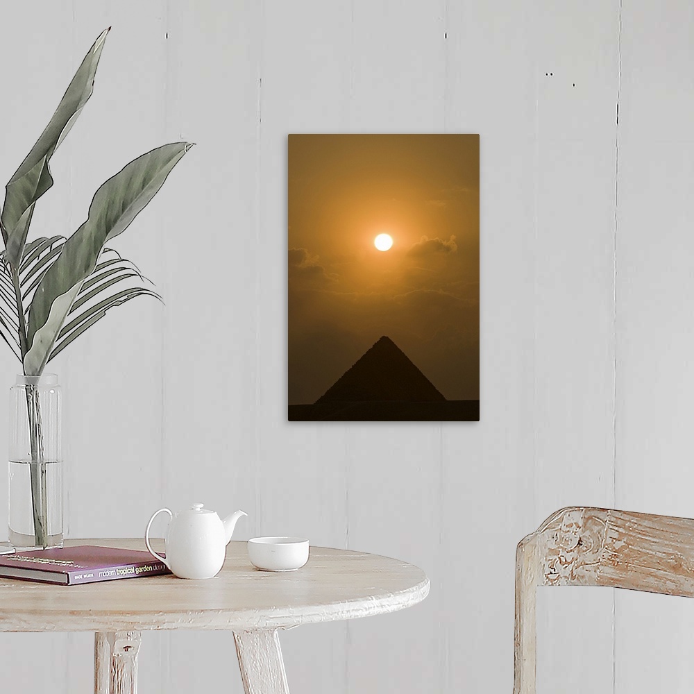 A farmhouse room featuring The sun begins to set above The Great Pyramid of Giza, in Cairo, Egypt.