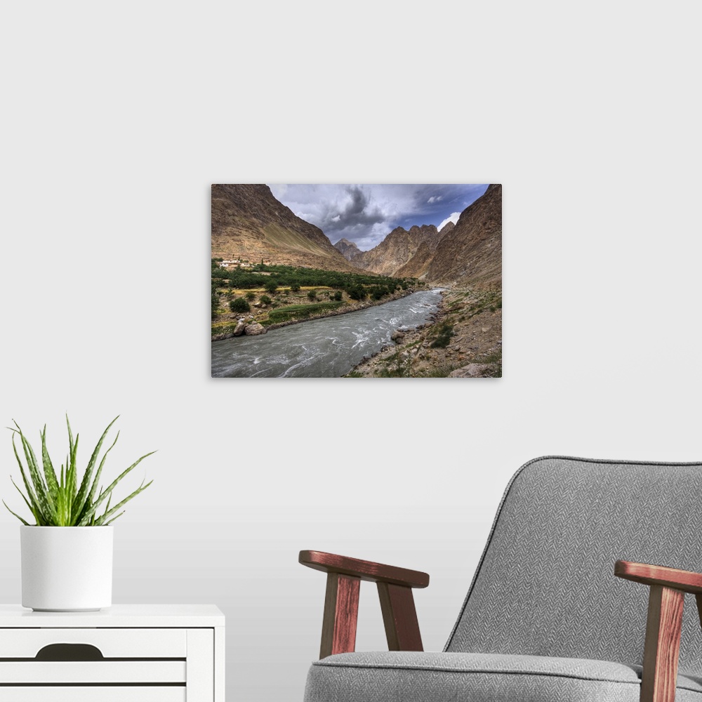 A modern room featuring Shot on the road between Khorog and Kalaikhum along the Pamir highway in Tajikistan. The river ma...