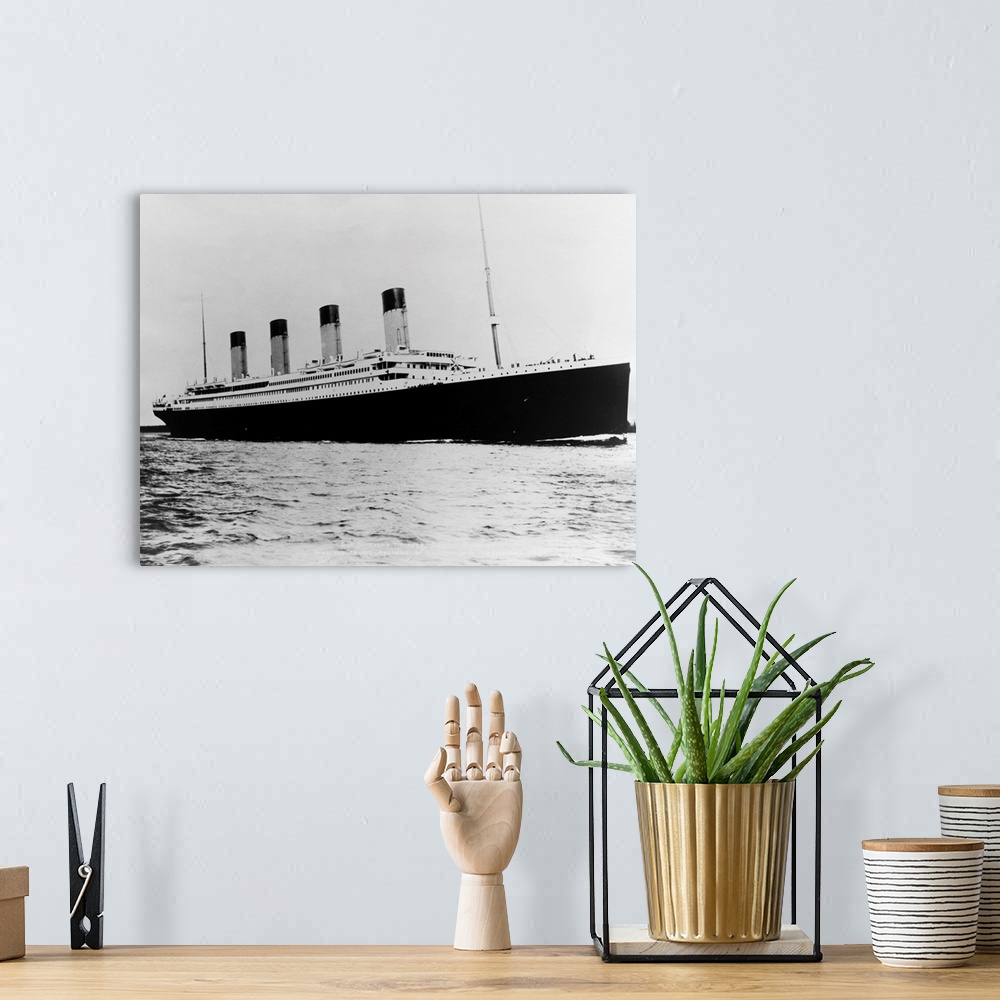 A bohemian room featuring Photo shows the ill-fated luxury liner, the Titanic, sailing the ocean..