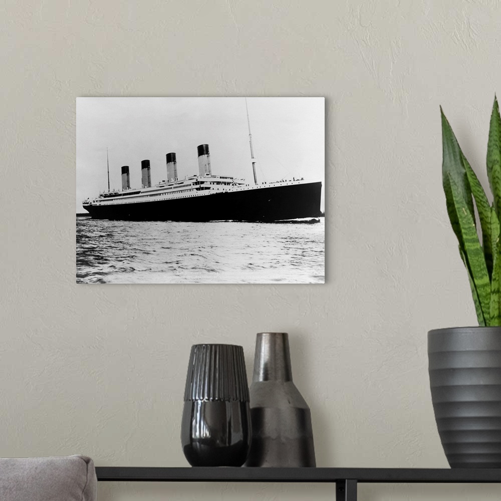 A modern room featuring Photo shows the ill-fated luxury liner, the Titanic, sailing the ocean..