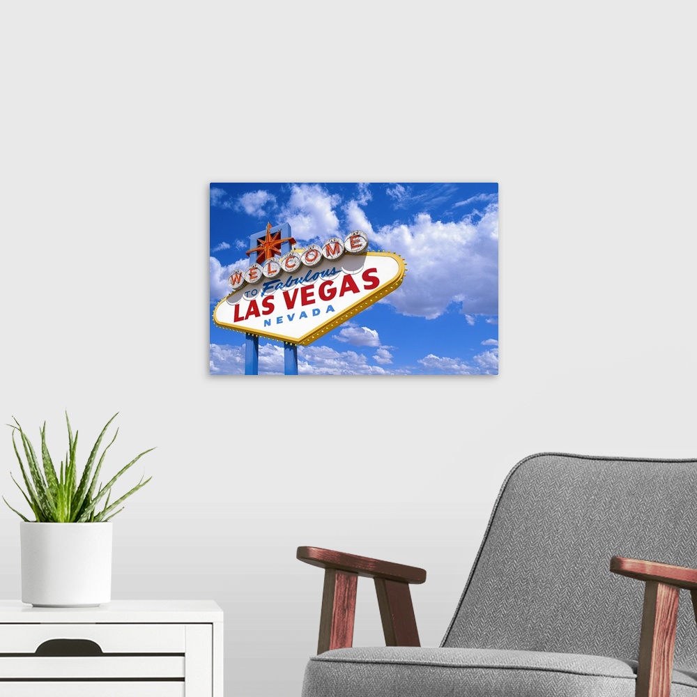 A modern room featuring The ?Welcome to Fabulous Las Vegas Nevada' sign against a blue sky