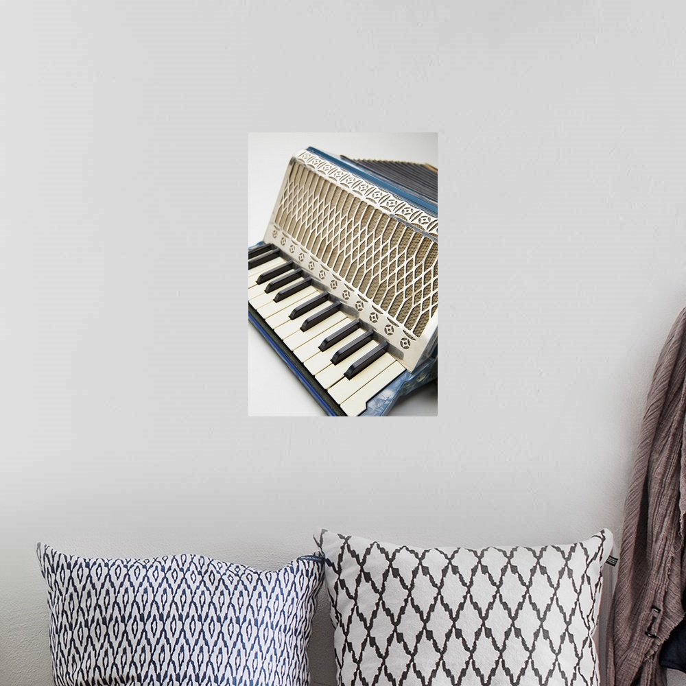 A bohemian room featuring This musical instrument is a circa 1930's German accordion.