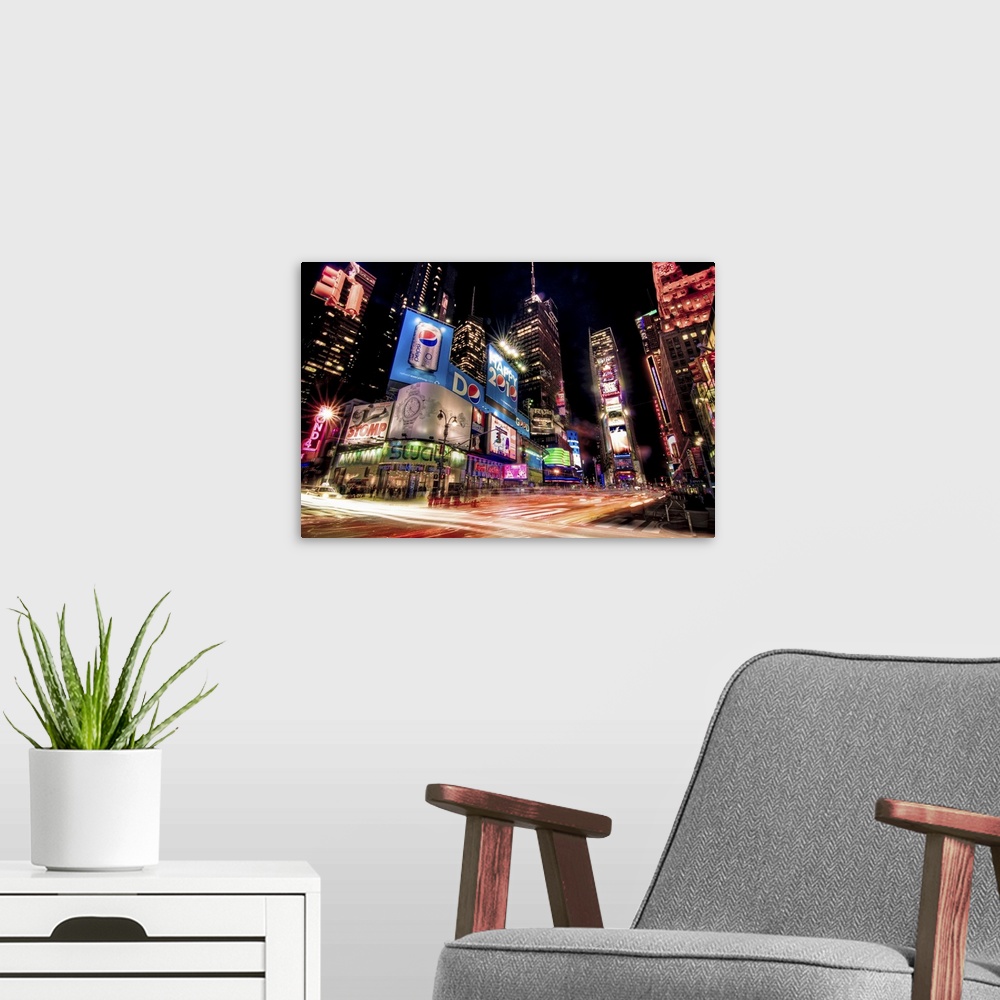 A modern room featuring Night photograph of the bright lights of Times Square in New York City, New York.