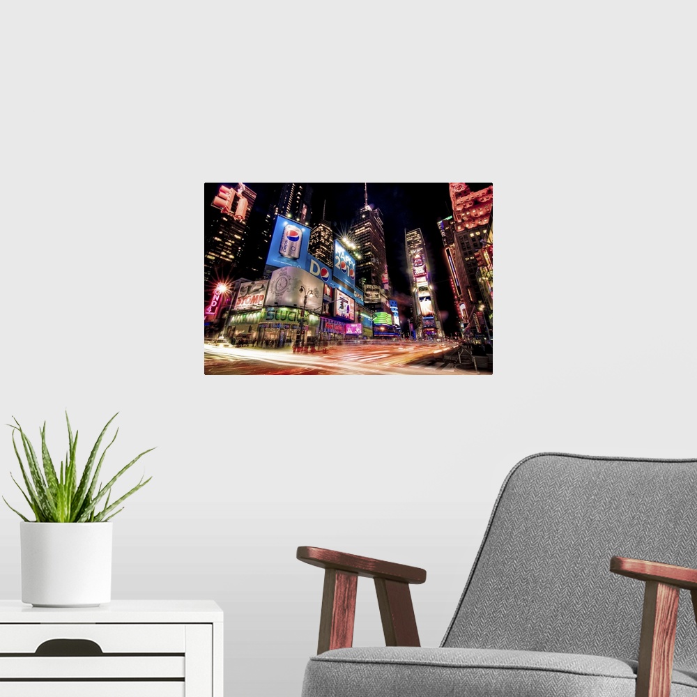 A modern room featuring Night photograph of the bright lights of Times Square in New York City, New York.