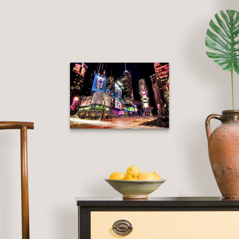 A traditional room featuring Night photograph of the bright lights of Times Square in New York City, New York.
