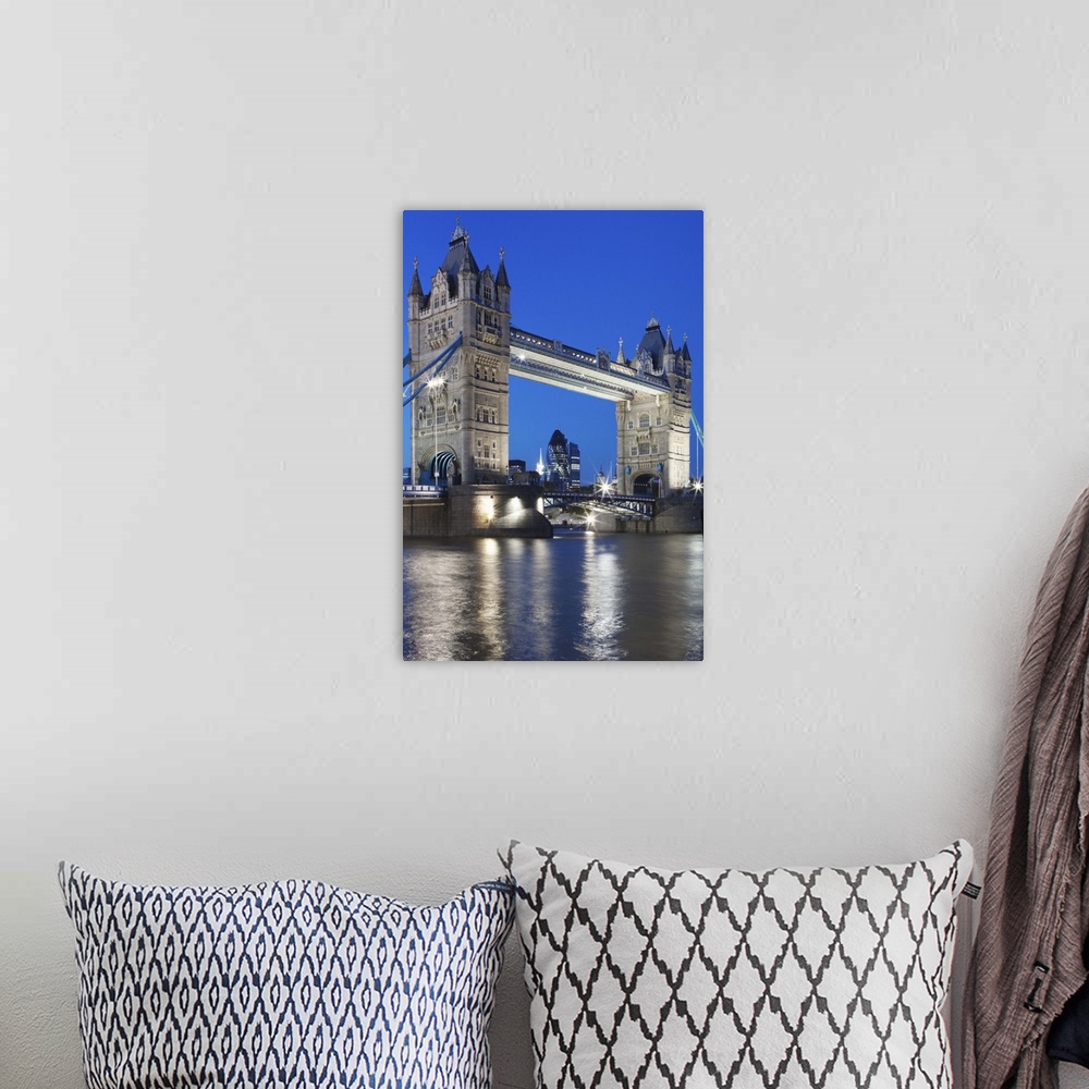 A bohemian room featuring Tower Bridge at dusk; London; England