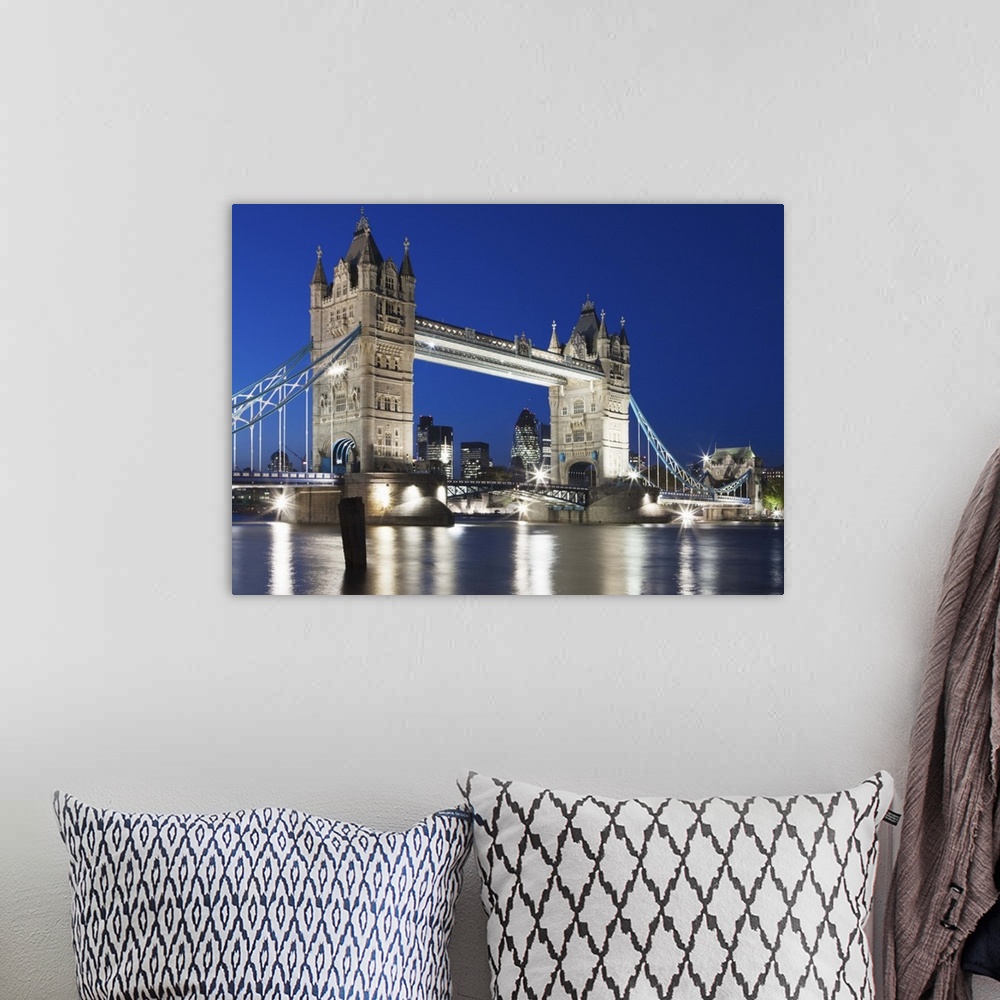 A bohemian room featuring Tower Bridge at dusk; London; England