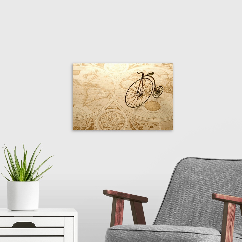 A modern room featuring An antique toy bike on top of an old map of the world.
