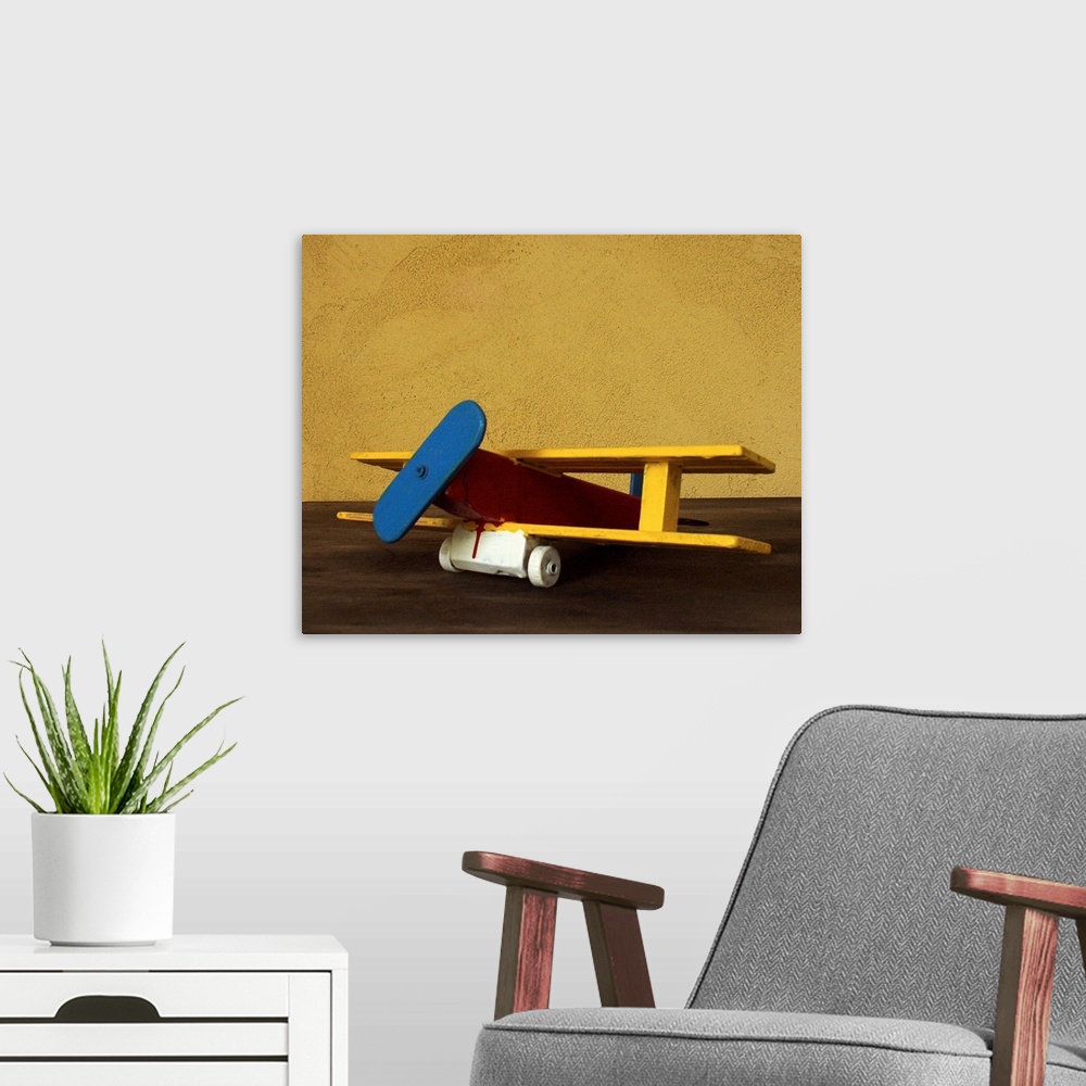 A modern room featuring Toy wooden airplane