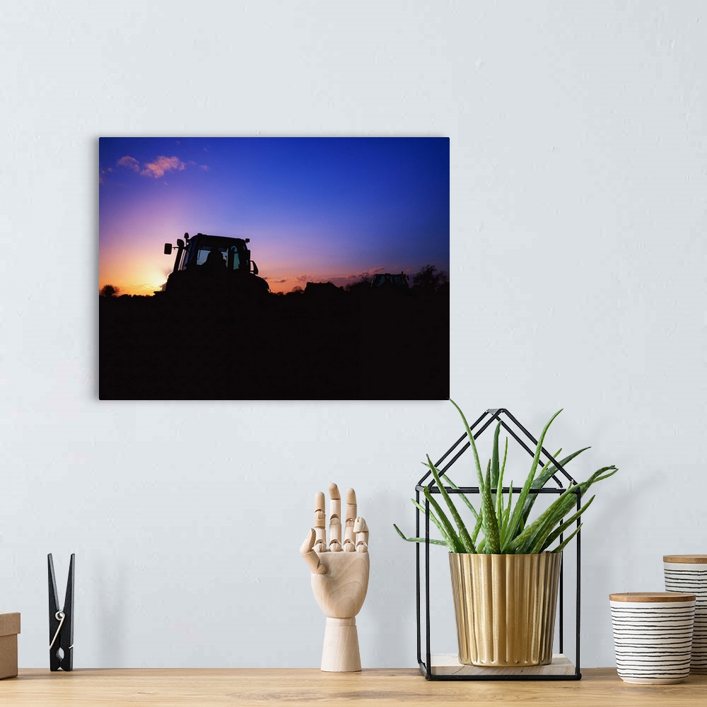 A bohemian room featuring Tractor Ploughing