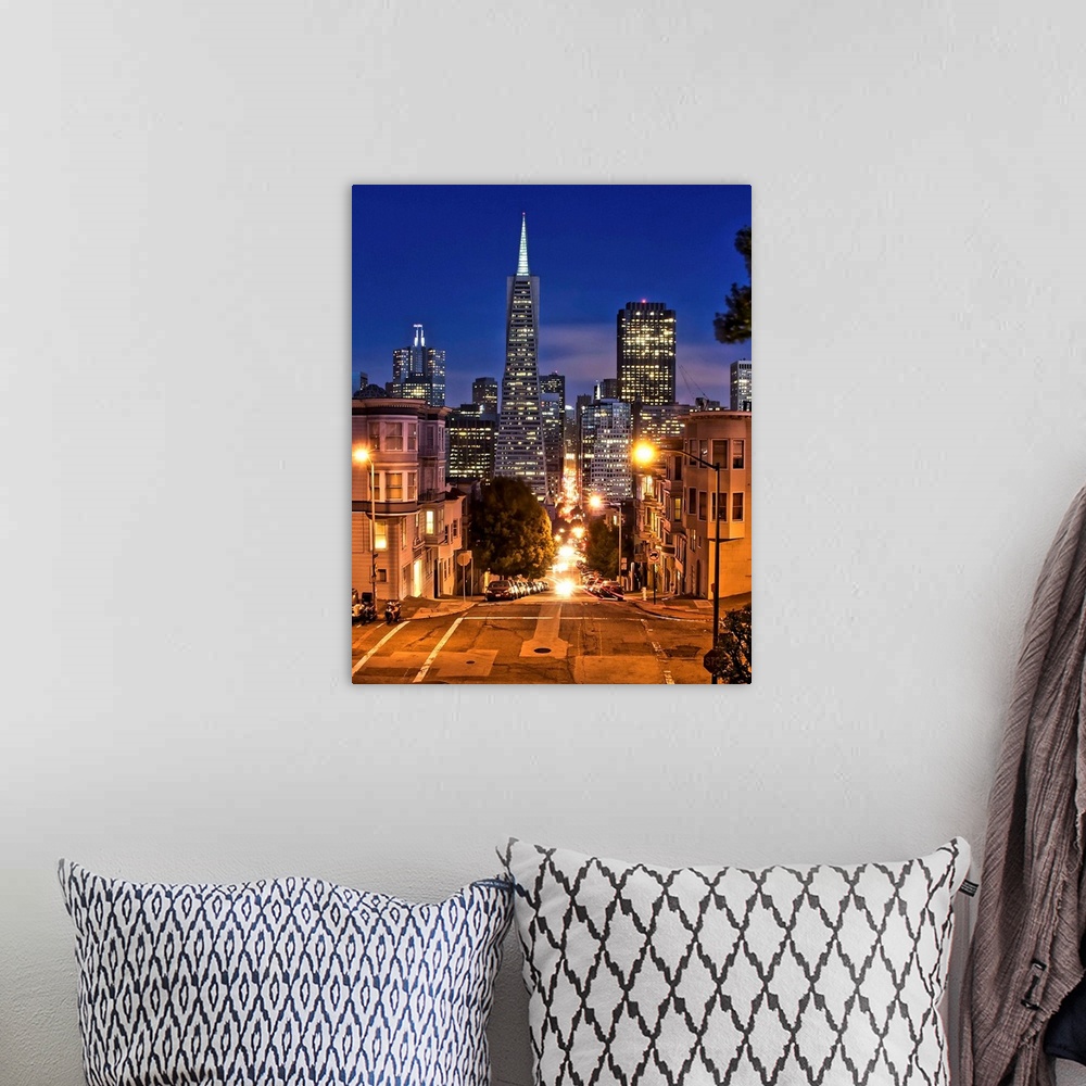 A bohemian room featuring Transamerica pyramid during blue hour seen from Montgomery street.