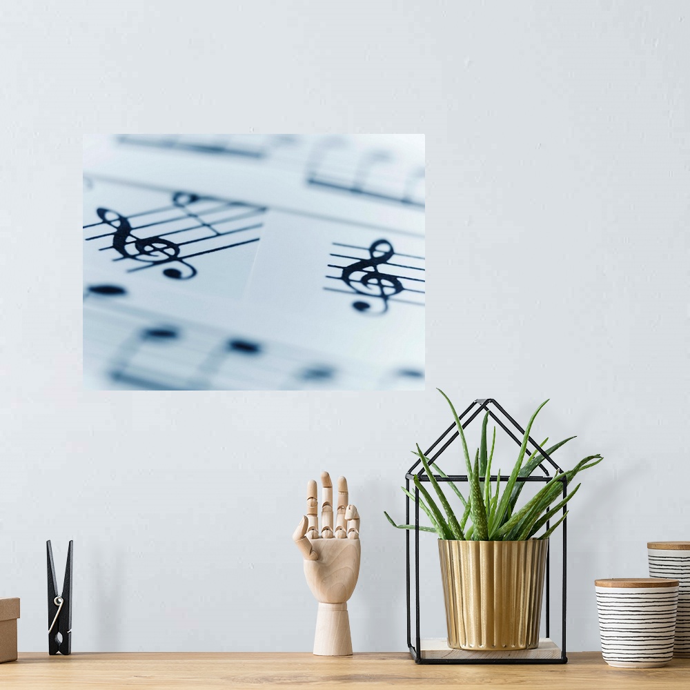 A bohemian room featuring Treble clef and musical notes on music sheets