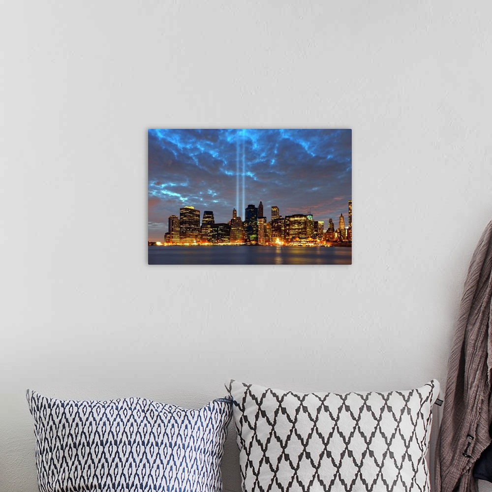 A bohemian room featuring Skyline view of city in night.