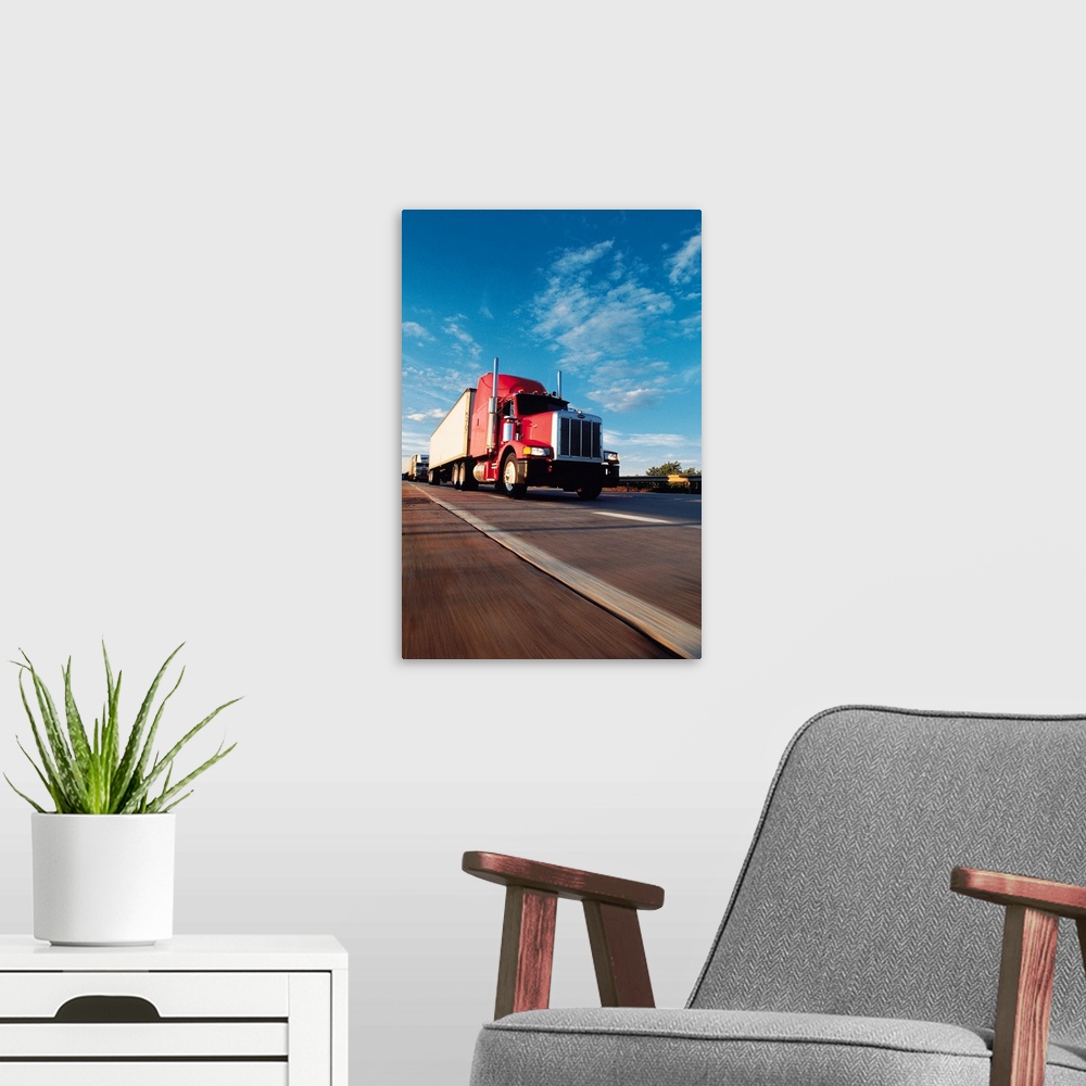 A modern room featuring Truck driving on highway