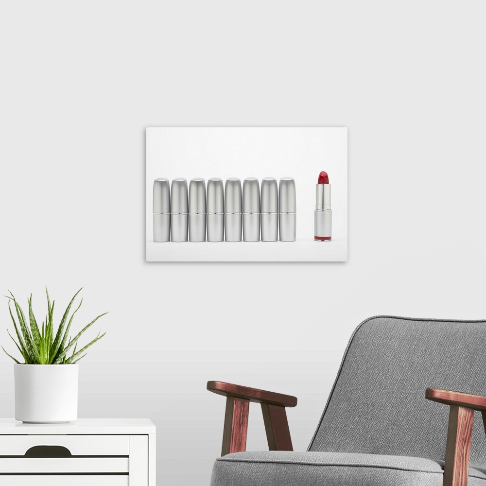 A modern room featuring Tubes of lipstick in a row