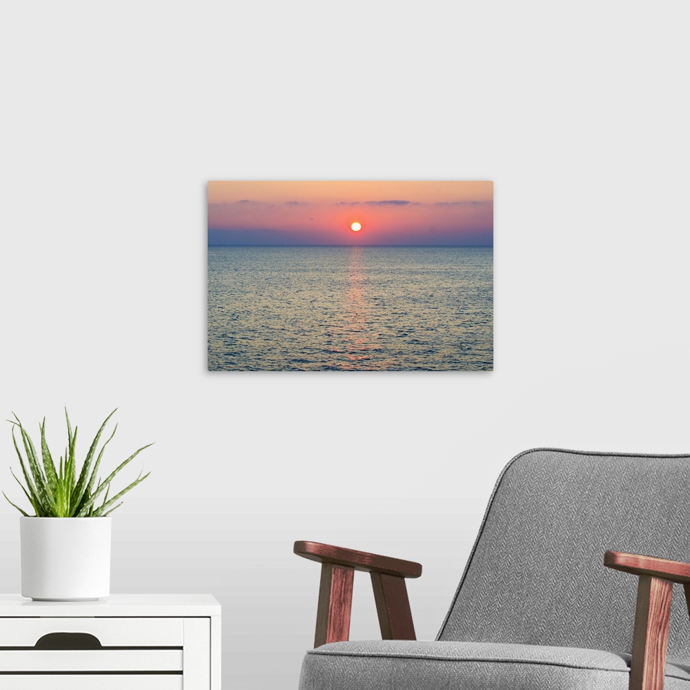 A modern room featuring Turkey, Aegean Sea horizon at sunset