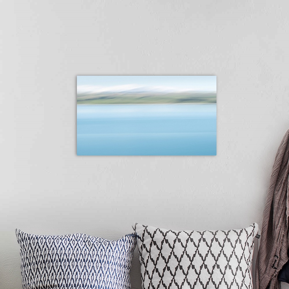 A bohemian room featuring Abstract image of turquoise colors of lake Pukaki with snow-capped mountains in the distance. Ima...