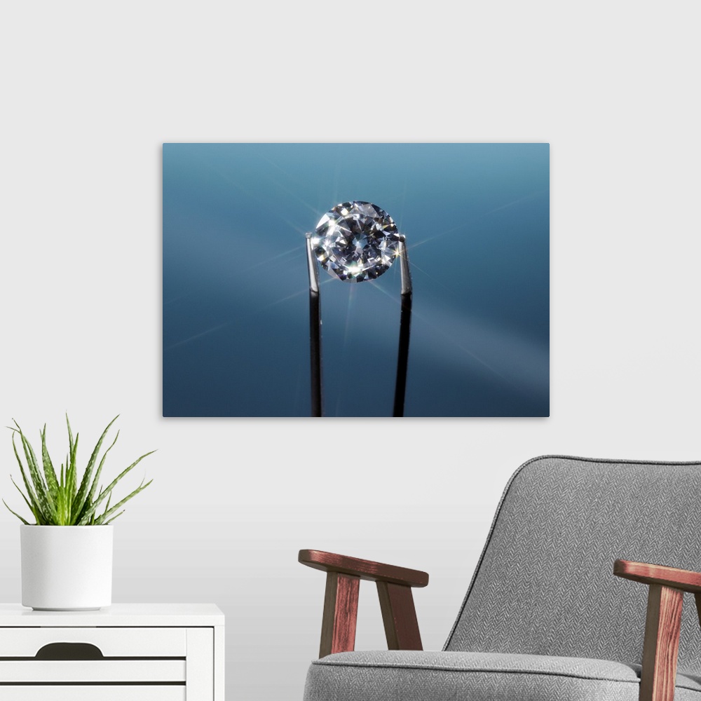A modern room featuring Tweezers holding diamond, close-up