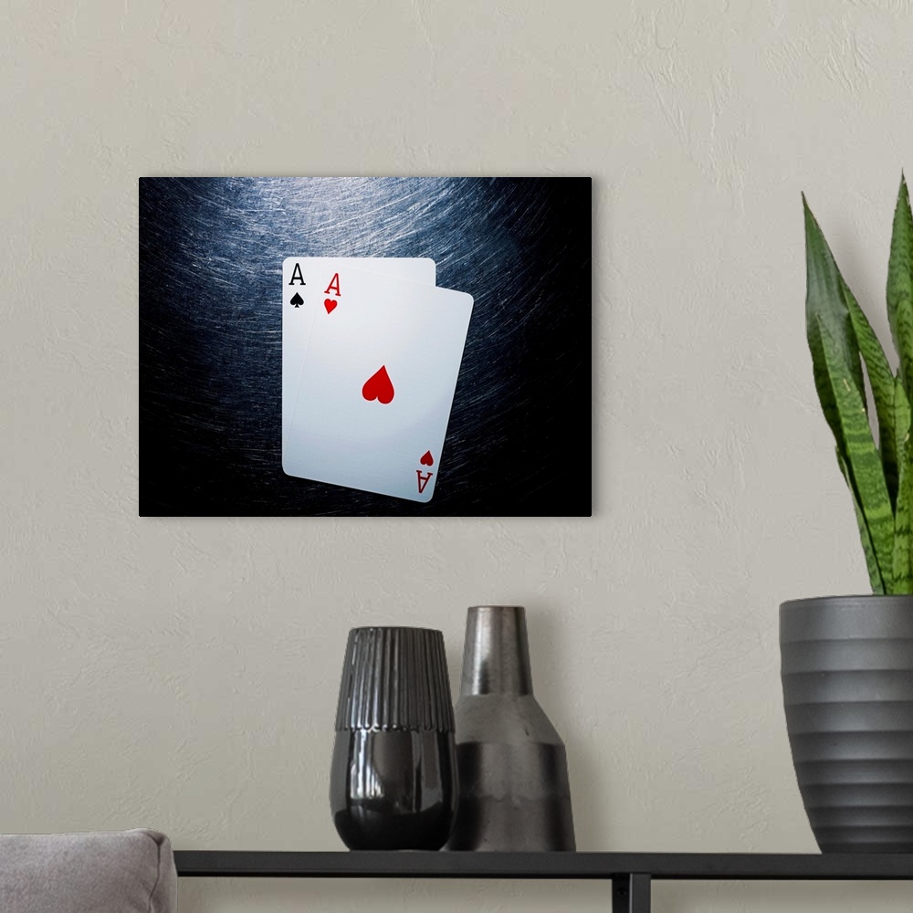 A modern room featuring Two Aces Playing Cards on Stainless Steel.