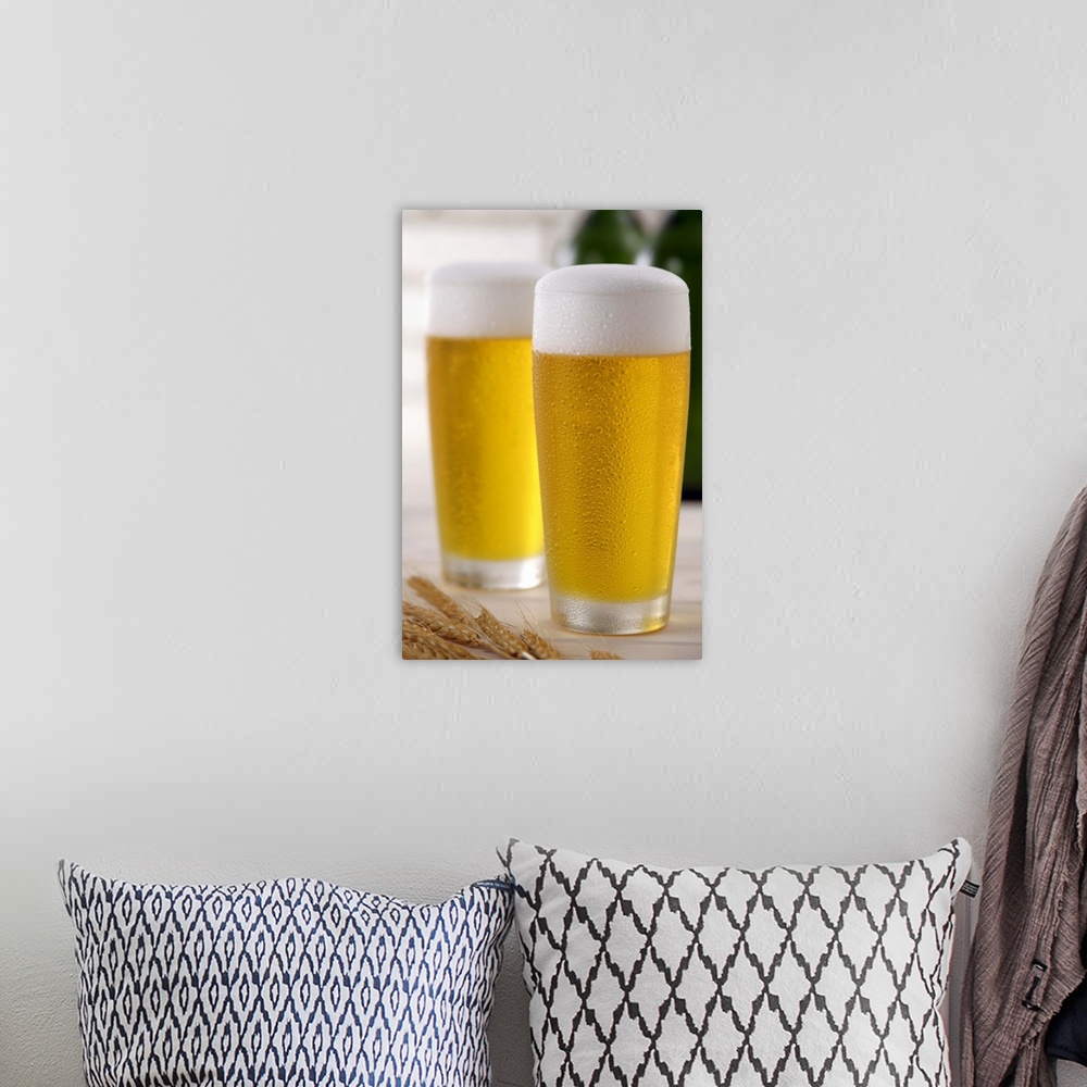 A bohemian room featuring Two glasses of beer