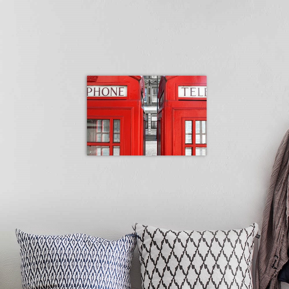 A bohemian room featuring Two London telephone boxes side by side.
