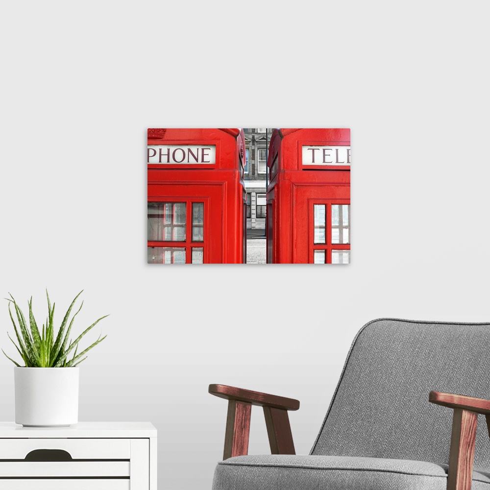 A modern room featuring Two London telephone boxes side by side.