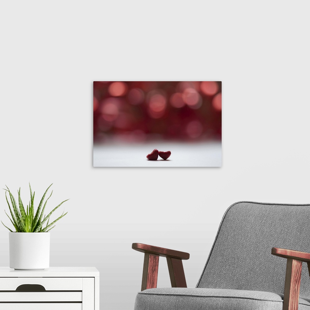A modern room featuring Two red hearts and red bokeh background