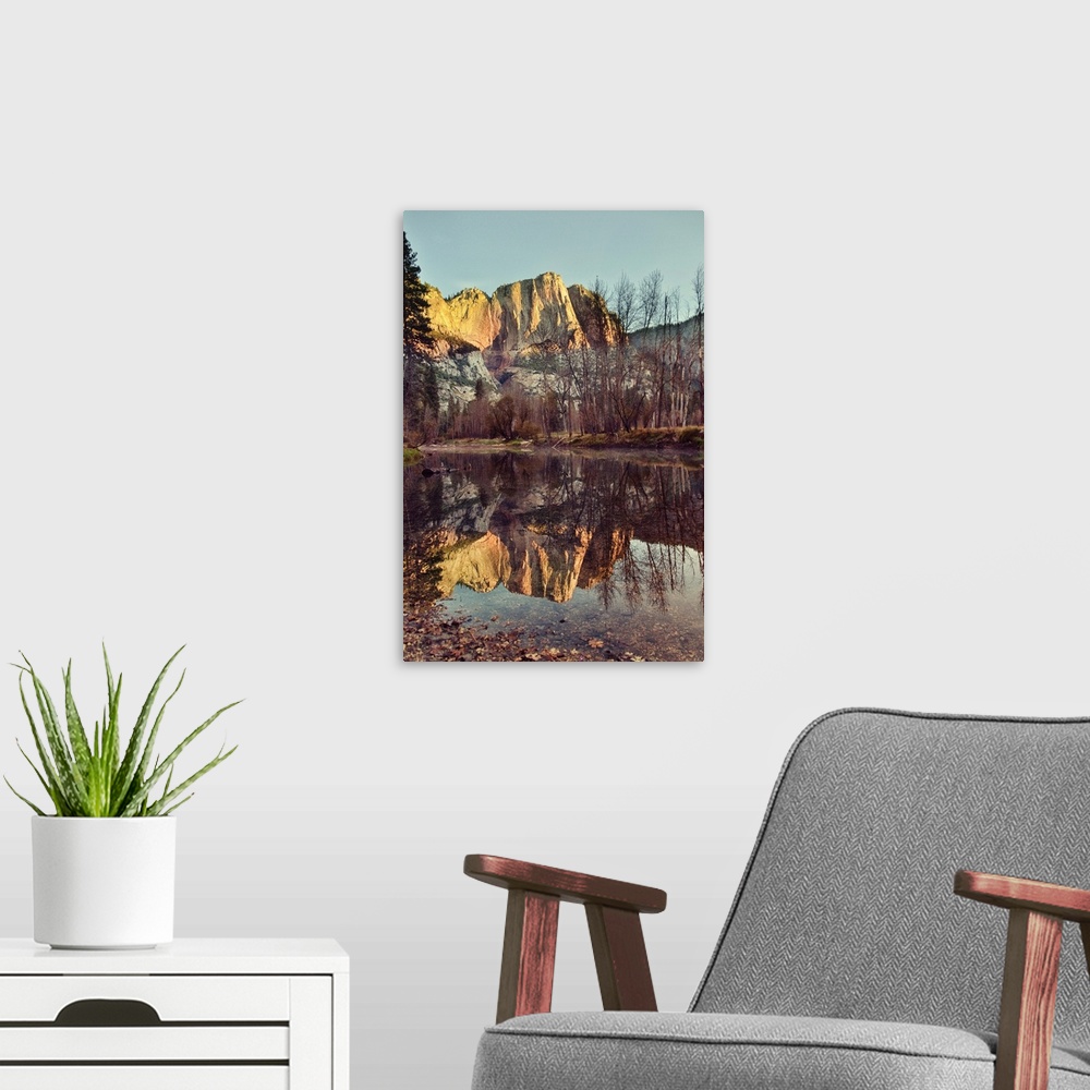 A modern room featuring Upper Yosemite falls at sunrise. Yosemite lodge river bend, reflections.