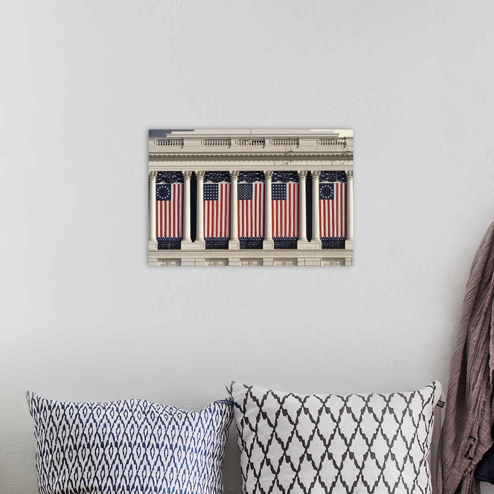 A bohemian room featuring US Capitol Building with American flags draped between columns
