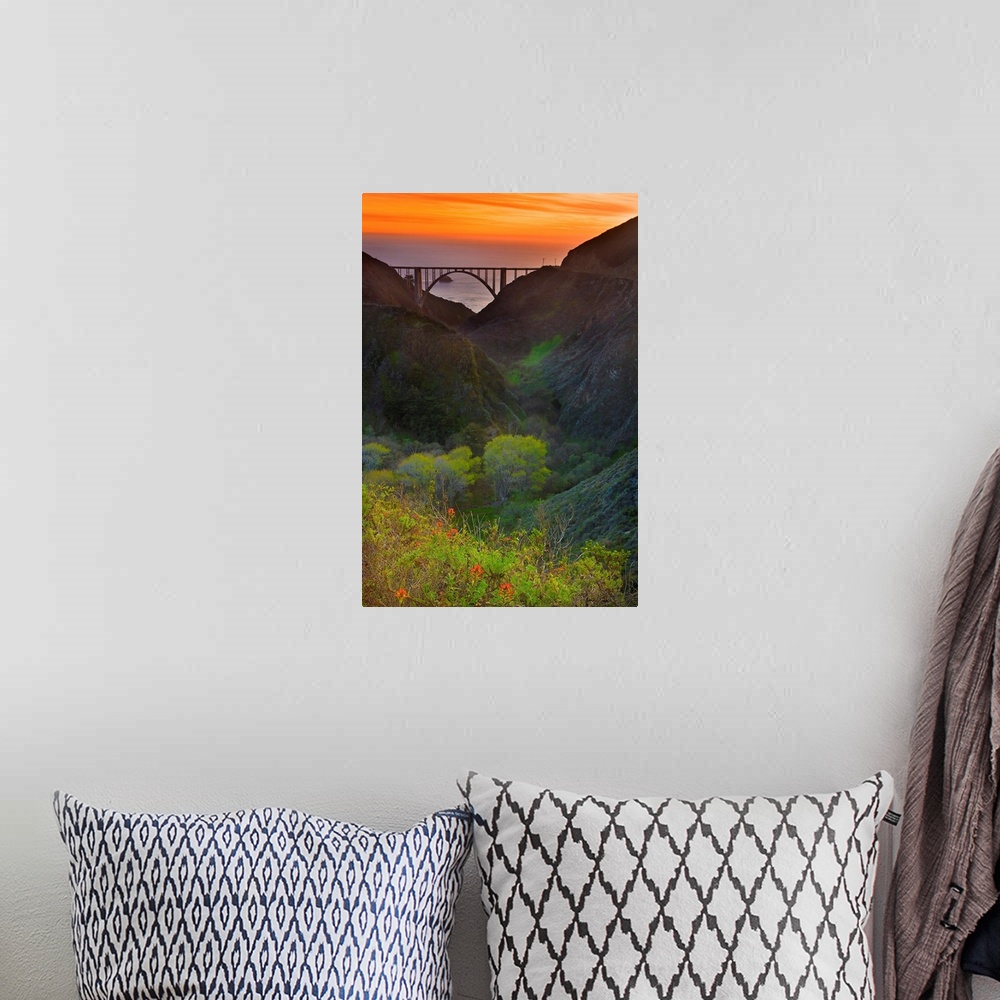 A bohemian room featuring Portrait oriented photo of the Big Sur bridge at sunset with rolling hills in the foreground and ...
