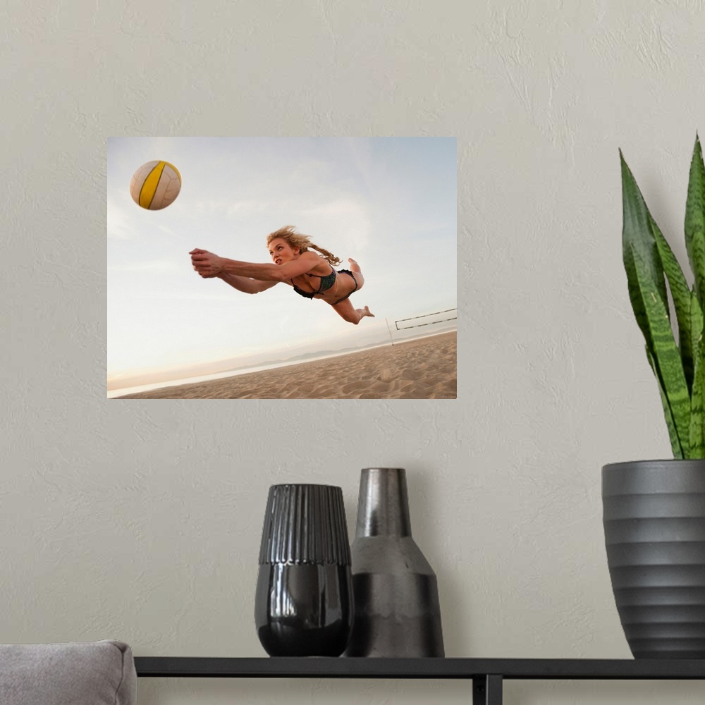 A modern room featuring USA, California, Los Angeles, woman playing beach volleyball