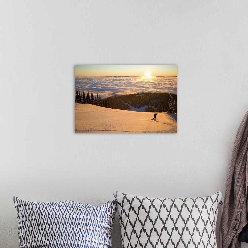 A bohemian room featuring Oversized horizontal photograph of a man snowboarding down a hill that is high above a winter lan...