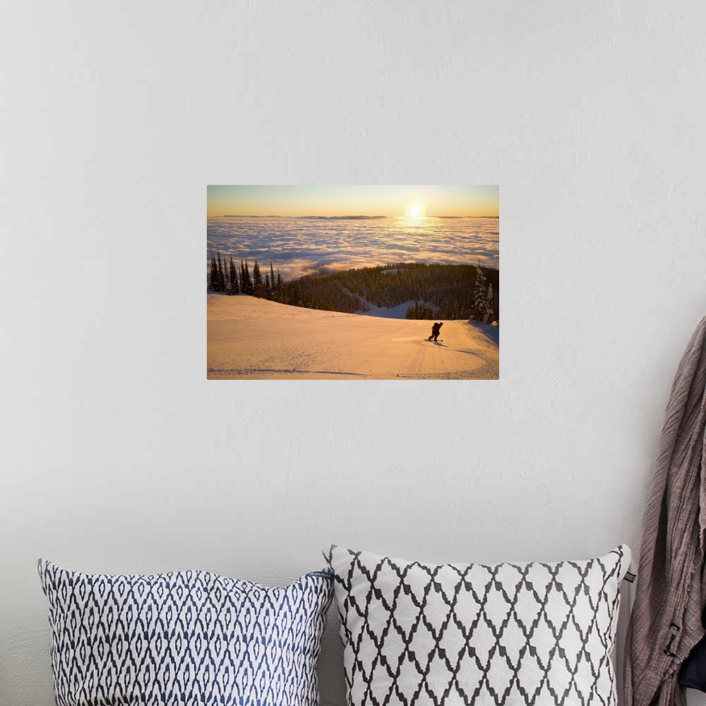 A bohemian room featuring Oversized horizontal photograph of a man snowboarding down a hill that is high above a winter lan...