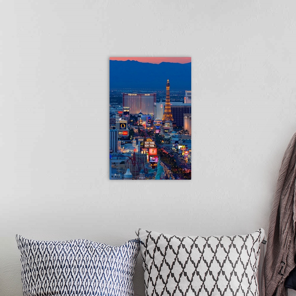 A bohemian room featuring Vertical, large, high angle photograph of the Las Vegas strip at night, including New York, New Y...