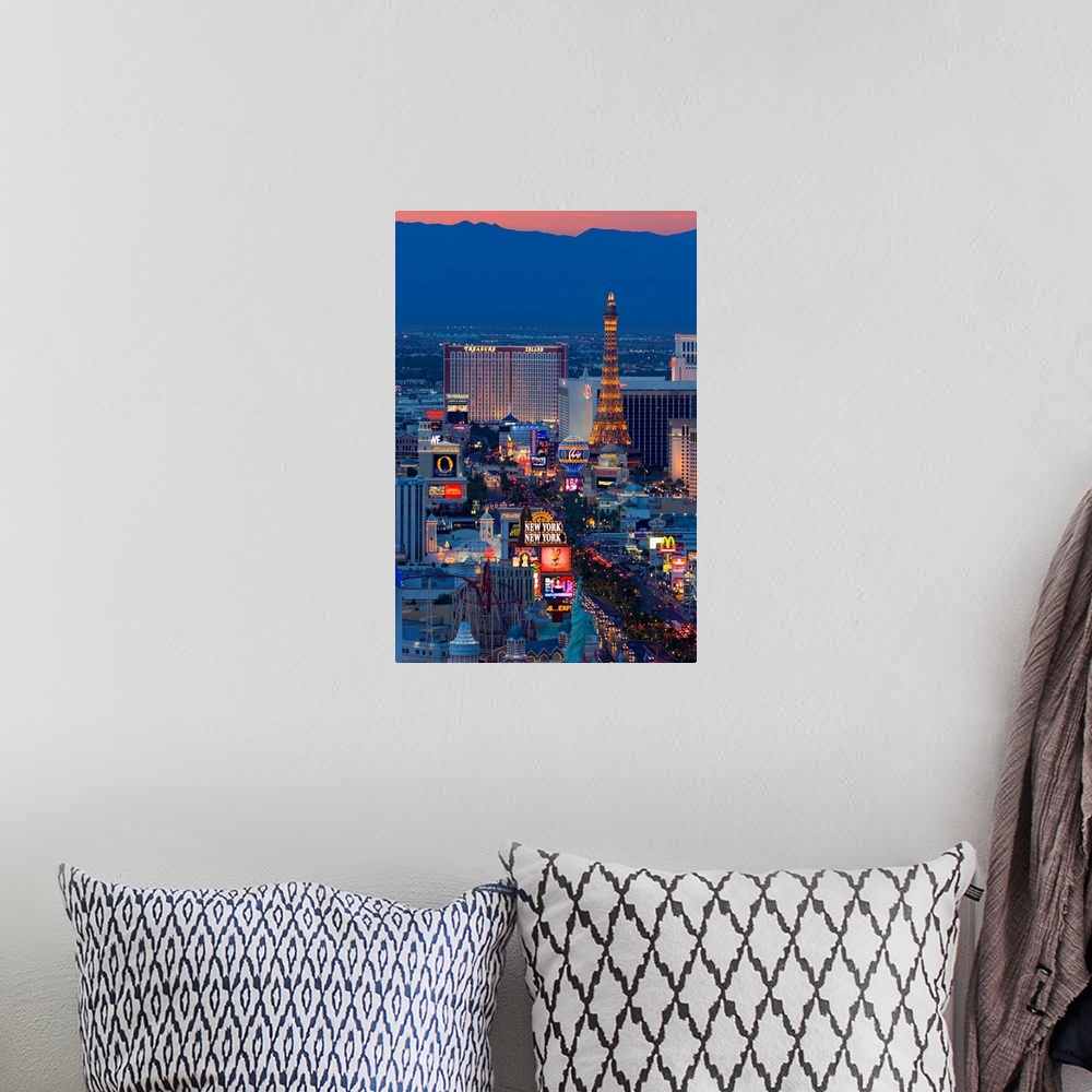A bohemian room featuring Vertical, large, high angle photograph of the Las Vegas strip at night, including New York, New Y...
