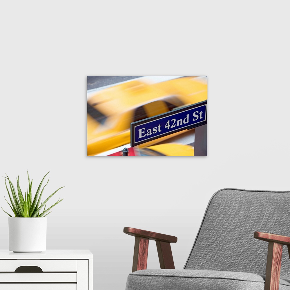 A modern room featuring USA, New York City, Manhattan, Road direction sign on 42nd Street