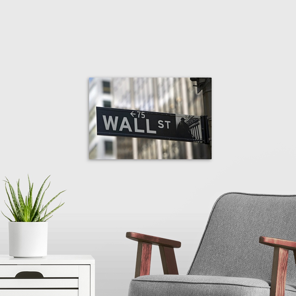 A modern room featuring Large print of an iconic financial district sign with big city buildings in the background.