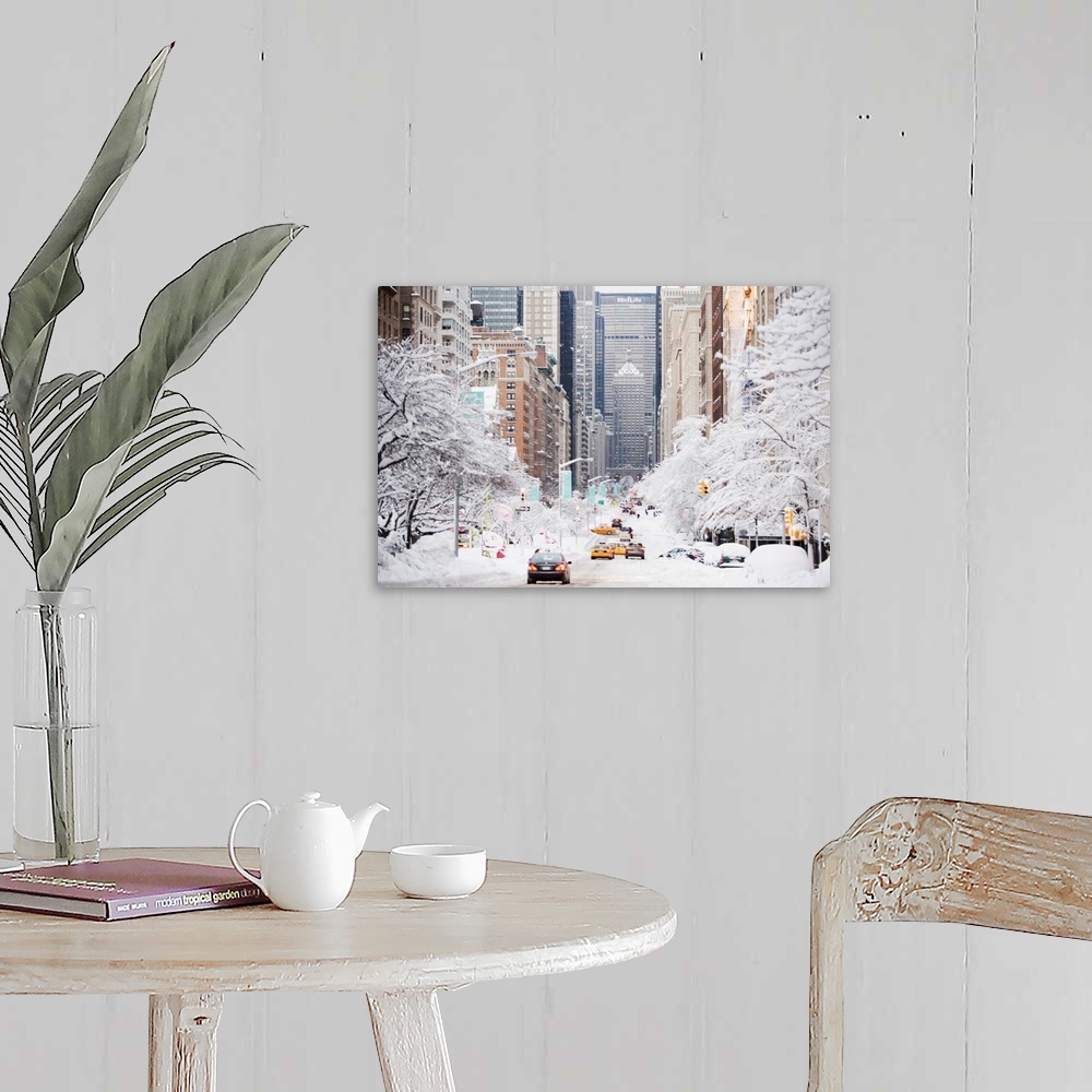 A farmhouse room featuring This photograph was taken looking down park avenue in NYC with the trees covered in snow on eithe...