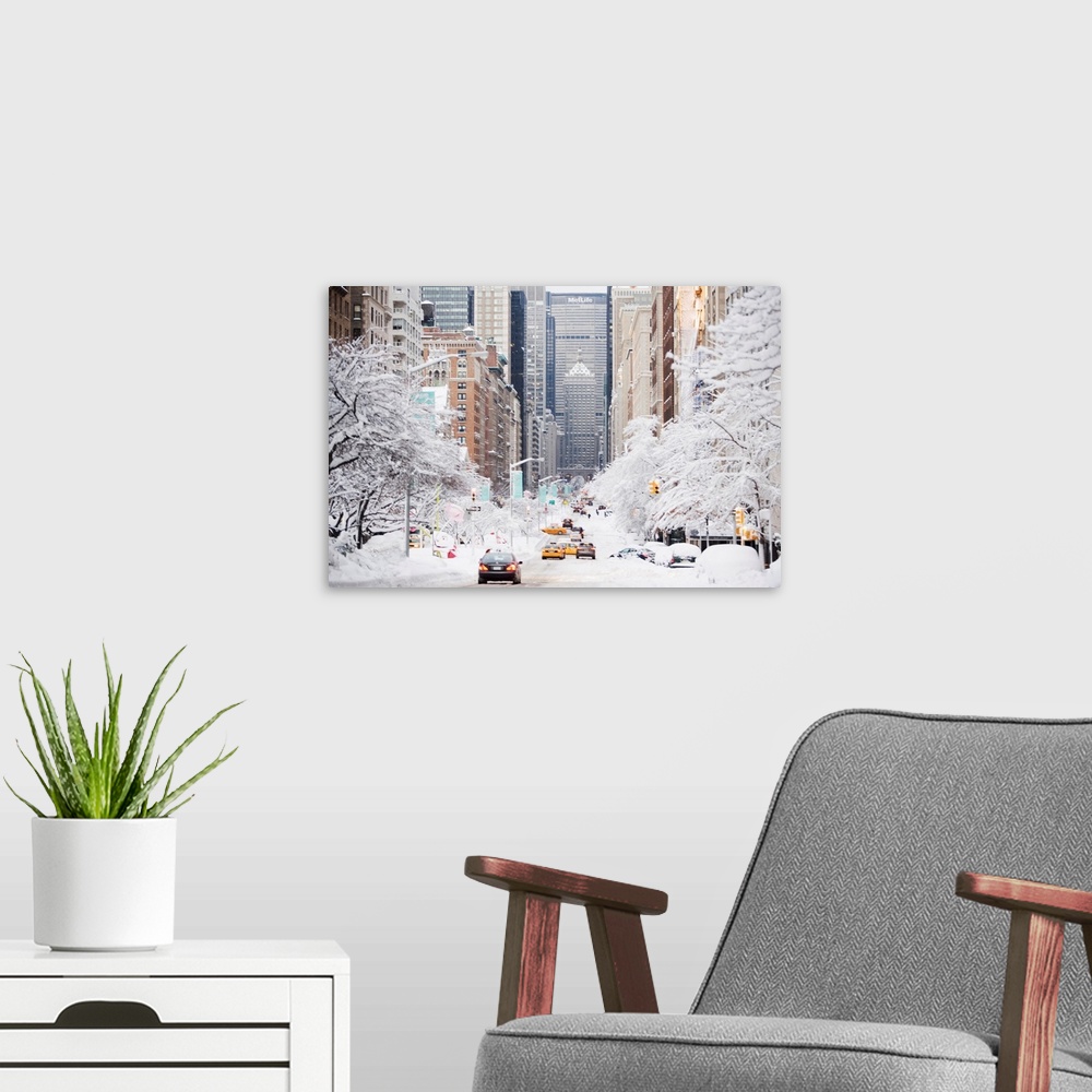 A modern room featuring This photograph was taken looking down park avenue in NYC with the trees covered in snow on eithe...