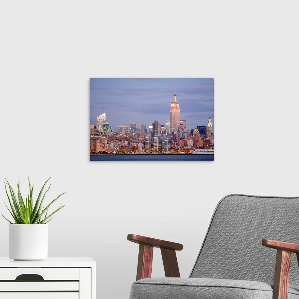A modern room featuring USA, New York State, New York City, Skyline at dusk