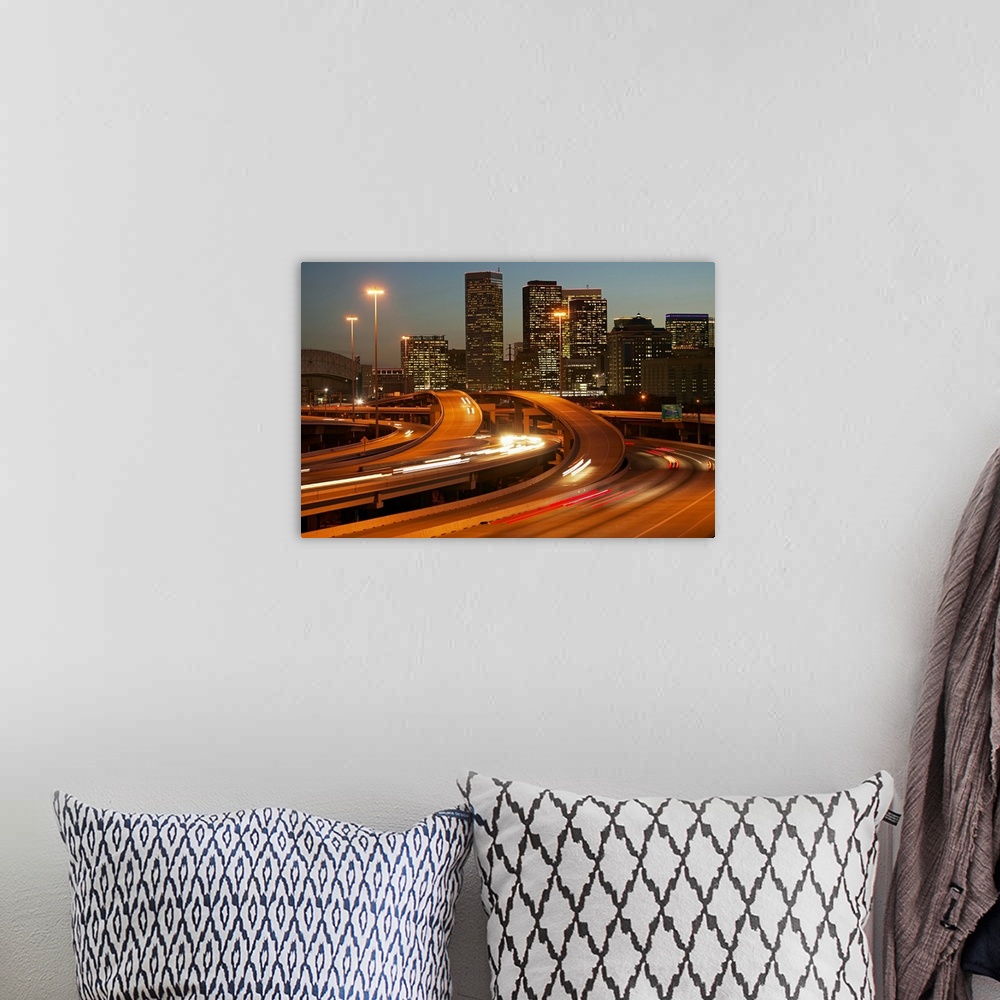 A bohemian room featuring Photograph of the Houston skyline taken at night with the buildings lit up and cars lights streak...
