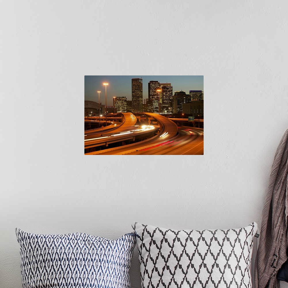 A bohemian room featuring Photograph of the Houston skyline taken at night with the buildings lit up and cars lights streak...