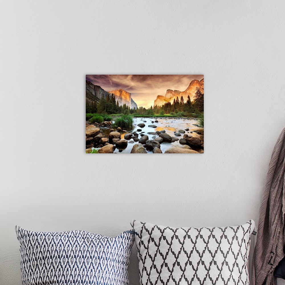 A bohemian room featuring A landscape photograph taken from the valley floor of this national park as the sun illuminates t...