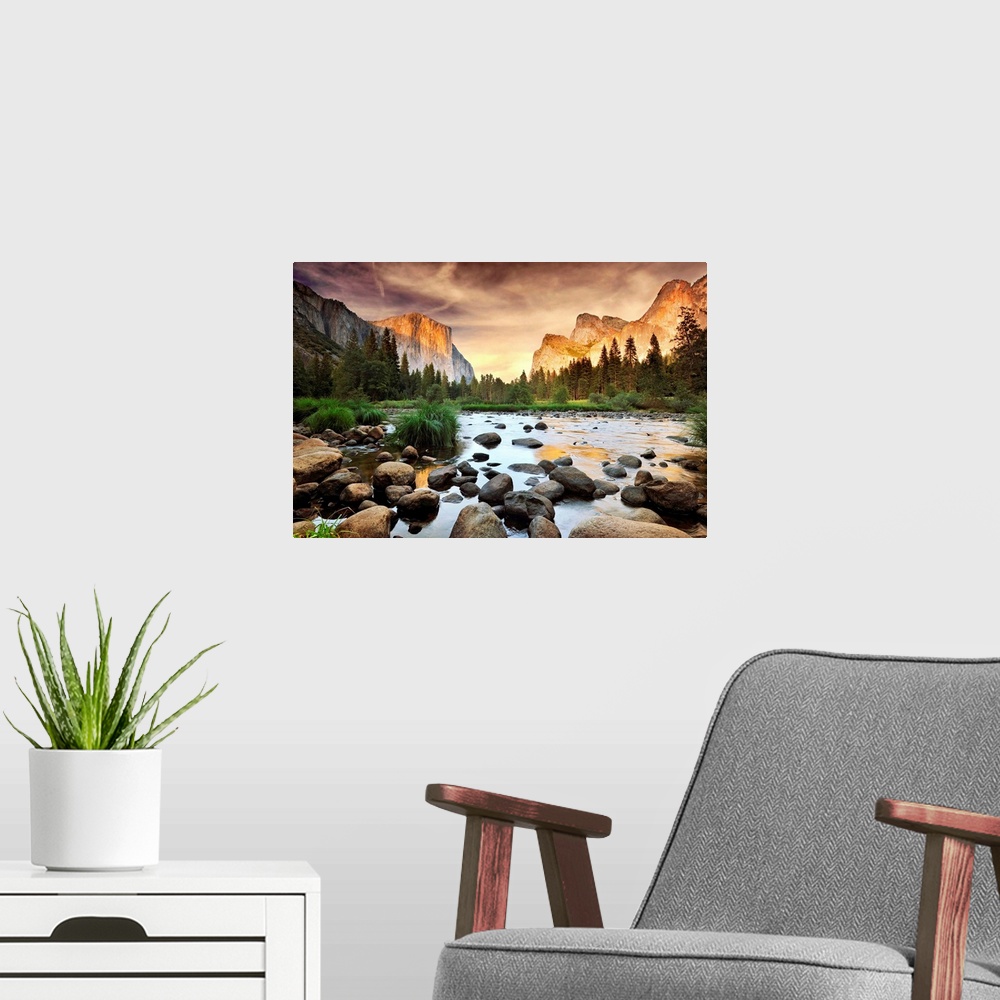 A modern room featuring A landscape photograph taken from the valley floor of this national park as the sun illuminates t...