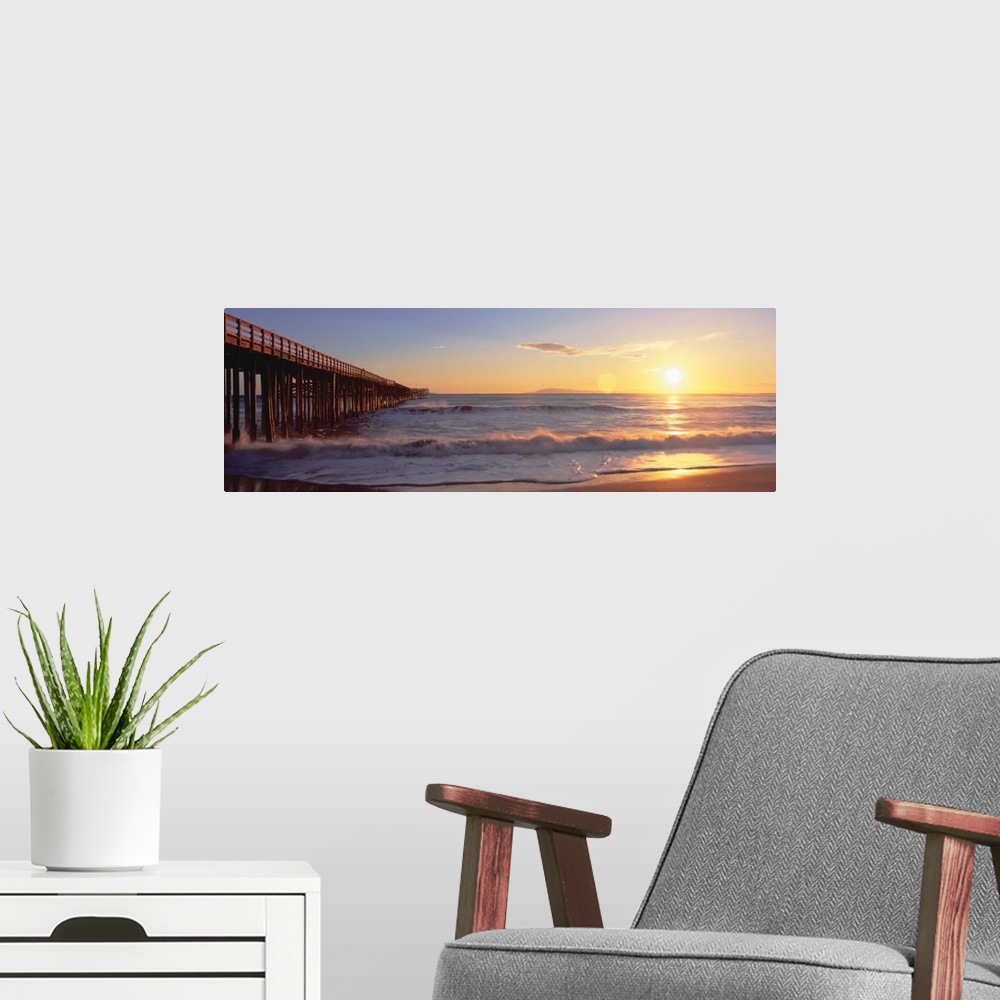 A modern room featuring 'Ventura pier at sunset, California'