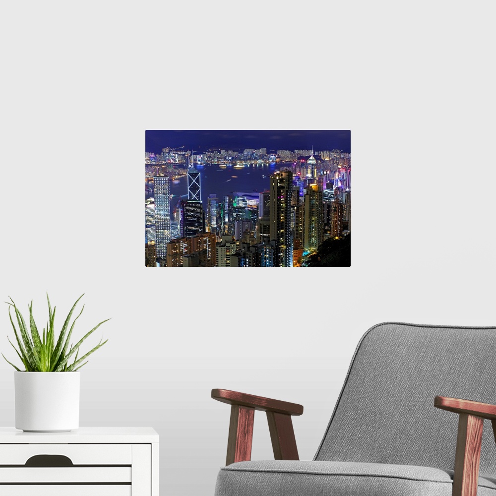 A modern room featuring View of cityscape of Hong Kong at night.