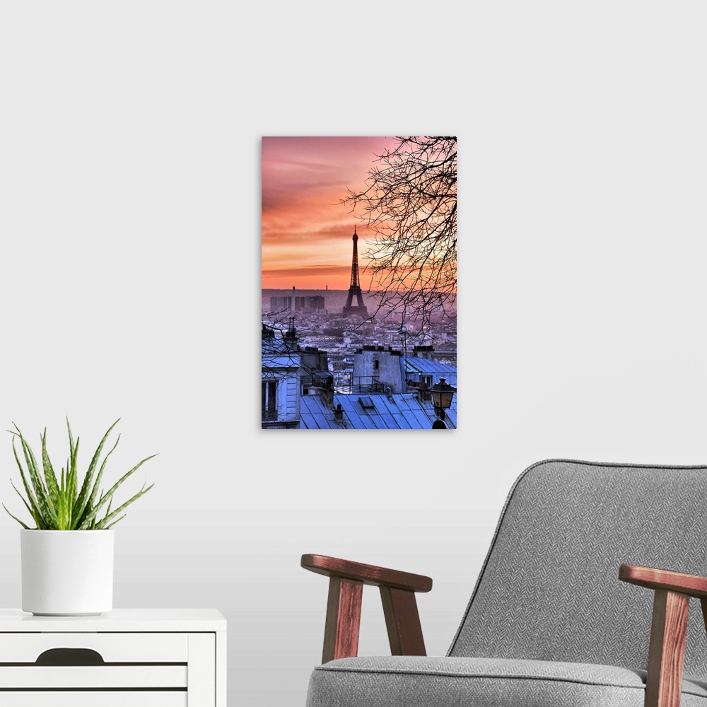 A modern room featuring Photograph taken of the Eiffel Tower from a distance with a view of the city surrounding it. The ...