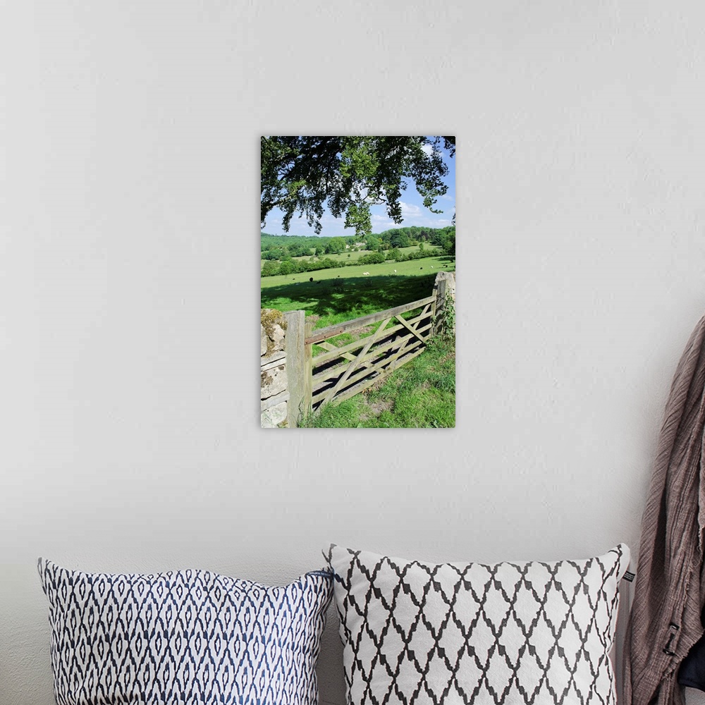A bohemian room featuring View of gate and farmland in english cotswolds.