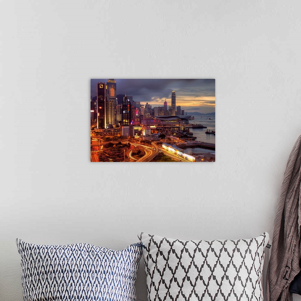 A bohemian room featuring Big landscape photograph of winding roads lading around and through the city of Hong Kong.  Skysc...